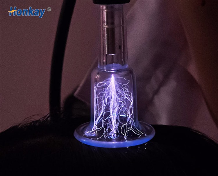plasma discharge visible at a handpiece tip during a cold plasma pass
